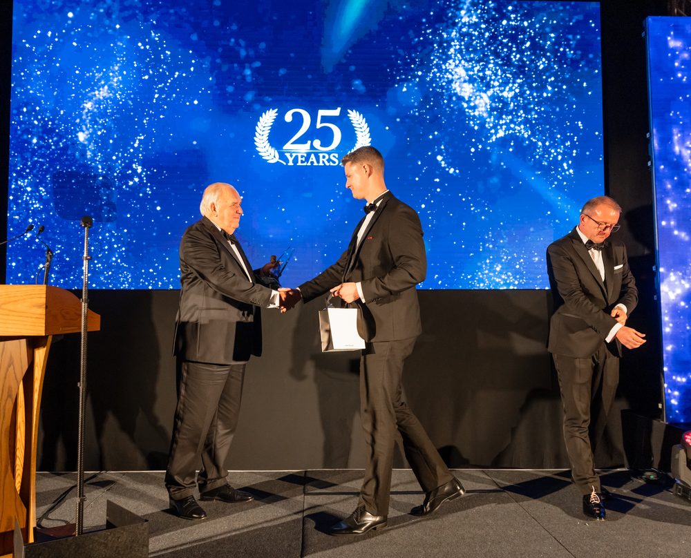 Jason Swan on stage receiving an award
